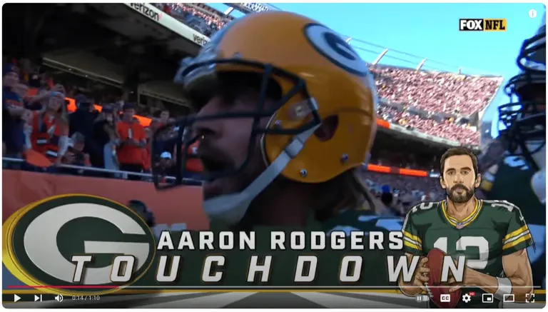 Aaron Rodgers shouting toward the stands at Soldier Field